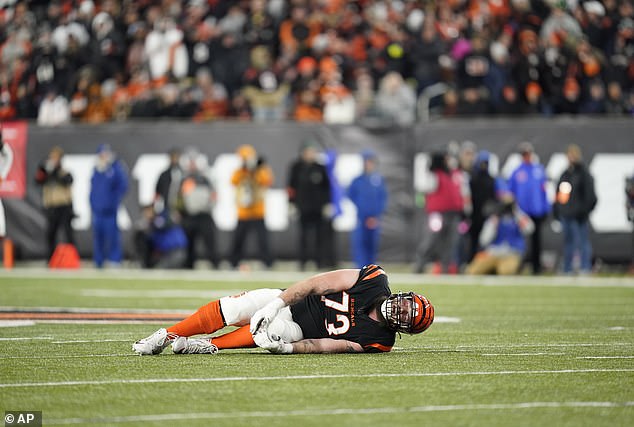 Jonah Williams clutches his leg in pain after hurting himself against the Baltimore Ravens during