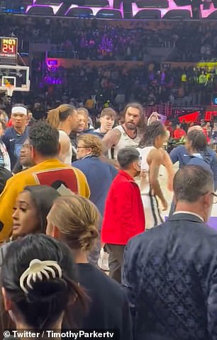 Grizzlies center Steven Adams walks away with teammate Ja Morant after the altercation