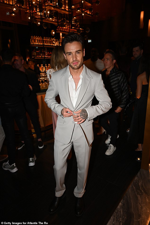 Looking good: Liam looked dapper in a suit