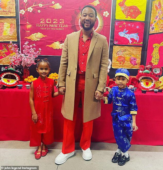 A-list dad: Chrissy's other half had a great time with the couple's two older children when she took Miles and Luna to their elementary school's Lunar New Year party on Friday.