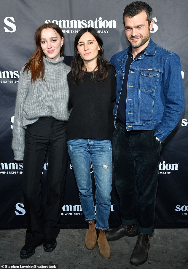 Trio: Phoebe, whose new movie Fair Play opened at Sundance that night, posed with Alden Ehrenreich, her co-star in the film, and its director Chloe Dumont.