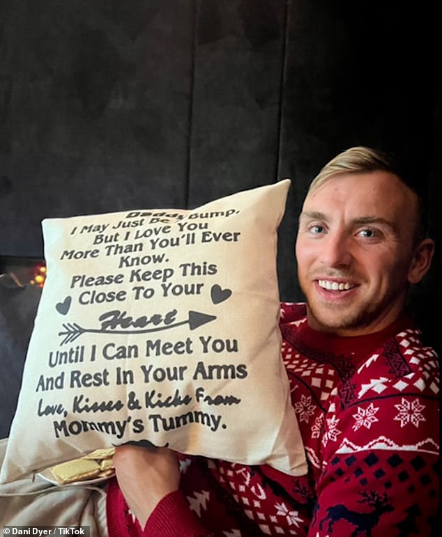 Dad-to-be: The TV personality included a snapshot of her boyfriend Jarrod holding up a sweet cushion