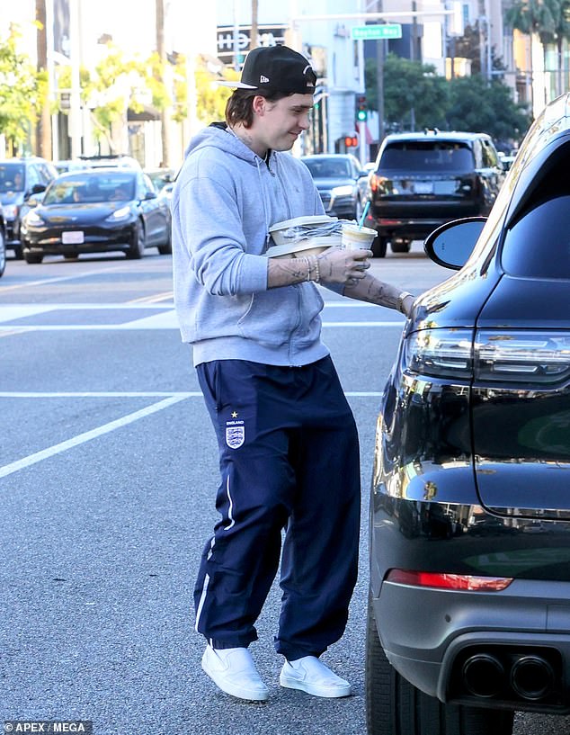 Like father, like son: The budding chef also decided to channel his father, David Beckham, 47, by rocking a pair of blue England tracksuit bottoms.