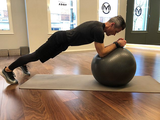 The extended ball plank, is not only great at toning your abs and upper body, it also helps strengthen your spine, which will do wonders for your posture.