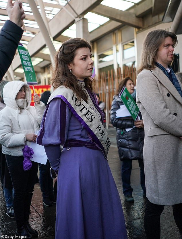 Nicole Jones (dressed as a suffragette) joined dozens of people who protested outside the Scottish Parliament building on Wednesday.