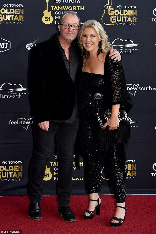 Country music star Gina Jeffreys and her husband, record producer Rod McCormack, opted for black outfits.  both in the photo