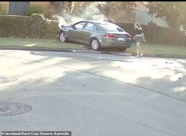 A barefoot woman (pictured) got out of the driver's side and walked around the car to open the front passenger door