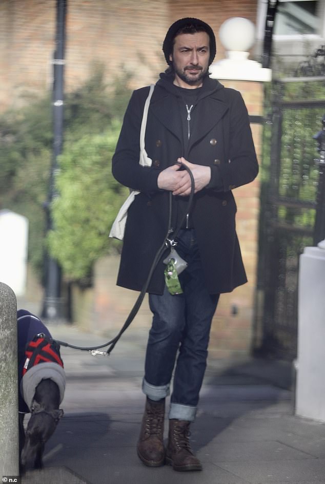 Time out: Stepping out with his pet Whippet, Alex strolled around north London, after announcing his split from Nettie, 35, just five months after their wedding