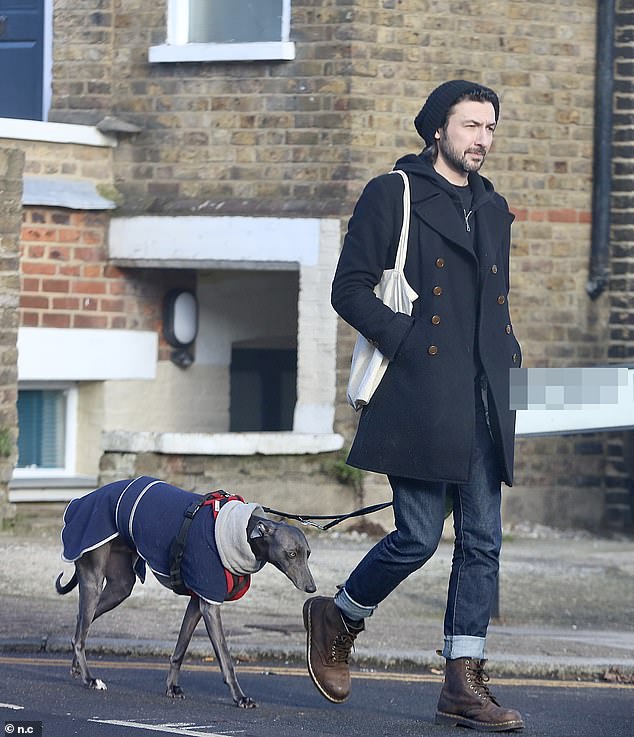 Winter chic: She layered a zip-up sweatshirt under her jacket and pulled on a pair of skinny jeans rolled up