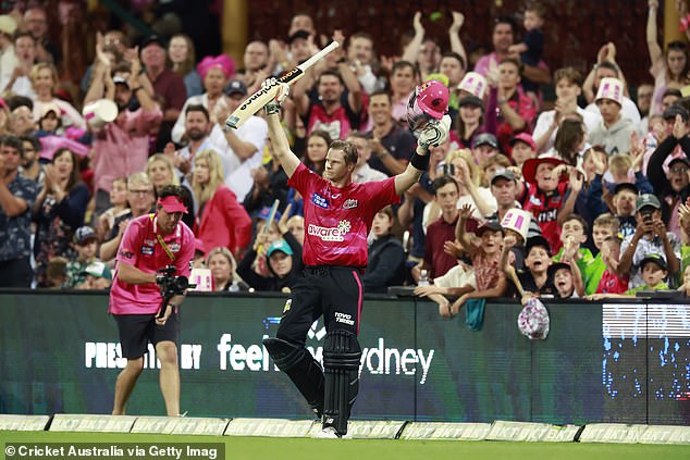 The 33-year-old celebrates with the fans as he walks off the pitch having held his wicket.