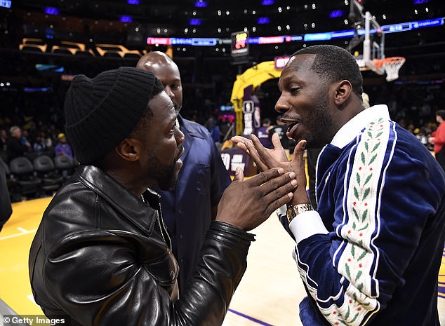 Chat: Kevin Hart (left) talks to Rich Paul (right) with Corey Gambel reacting during halftime of the Los Angeles Lakers and Memphis Grizzlies basketball game