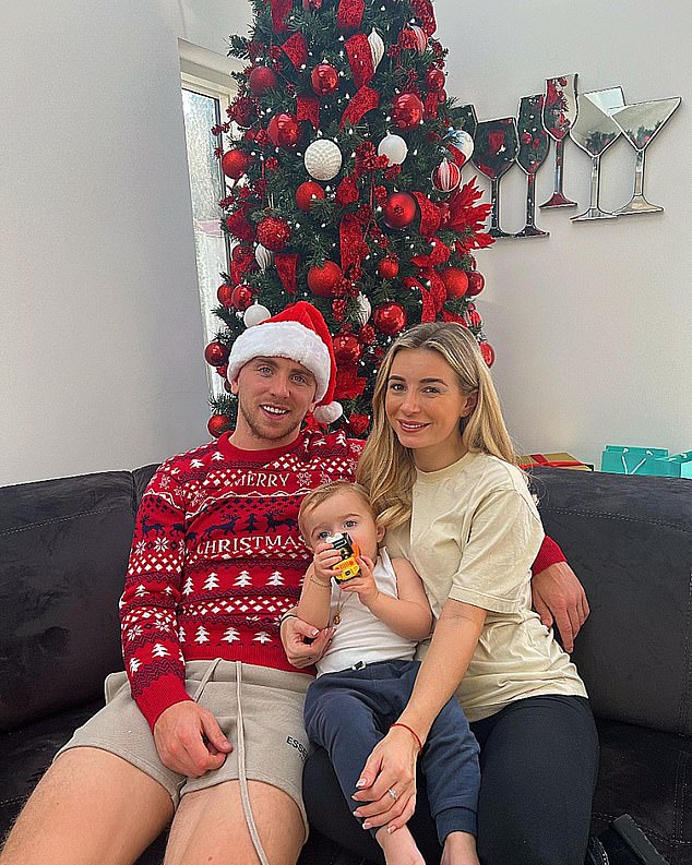 Together time: While the typically stylish mother of three should keep her look casual on Christmas Day by opting for an oversized beige T-shirt.