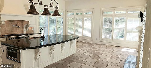 The beautiful kitchen had a large island and plenty of room to entertain before the fire.