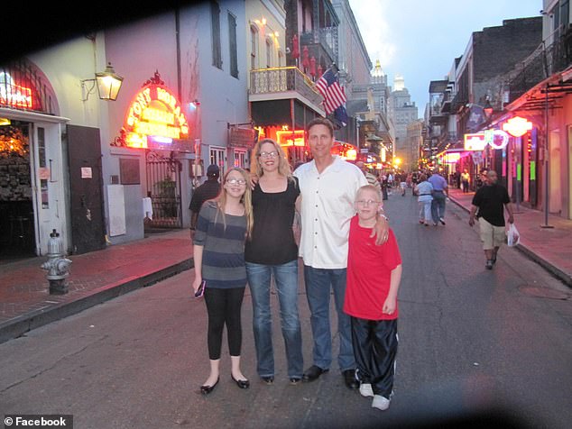 The judge (pictured with her husband and children) said she was forced to go to the FBI with the information after inaction by local police, with cops tracing her phone and claiming she was interfering with a vice investigation.