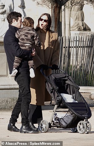 Sweet - caring parents had fun with their sun, making funny faces on the baby.