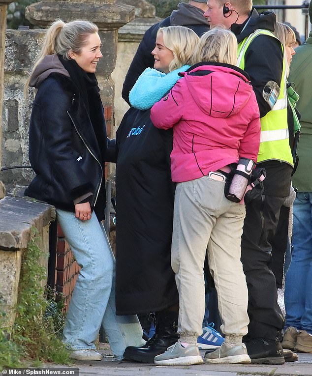 Production: Letting her blonde locks fall loose to her shoulders, she also wore a pair of black tights and matching boots