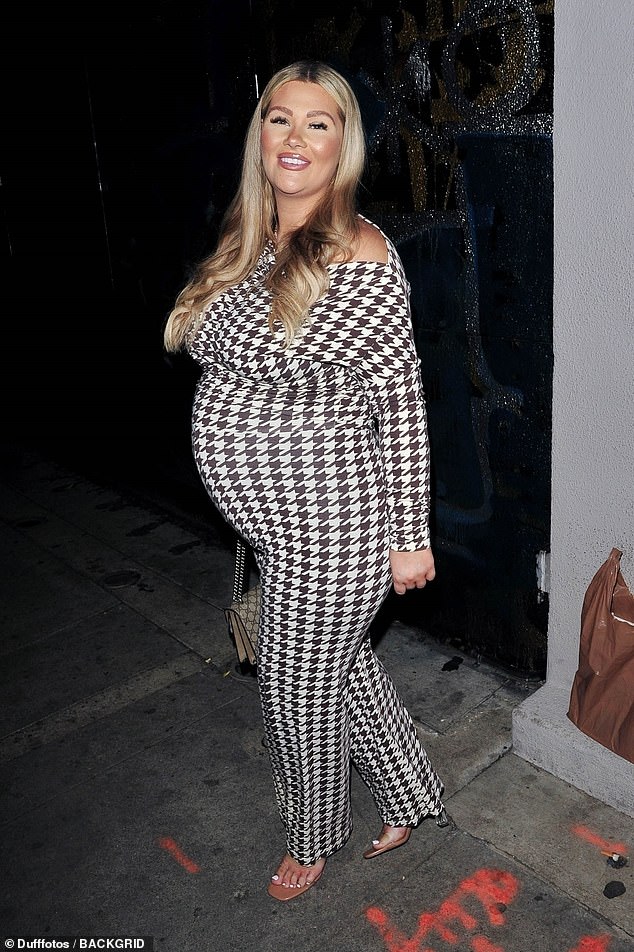 Stunner: The 28-year-old Love Island star, who is currently 30 weeks pregnant, looked stunning as she cradled her stomach as she left Craig's in West Hollywood