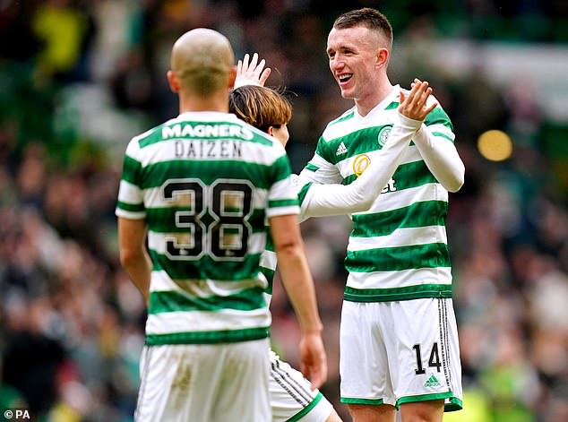 David Turnbull celebrates with teammates after finding the net during Celtic's win