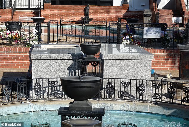 His gray marble sarcophagus is next to his burial place and is exactly the same as his son's.