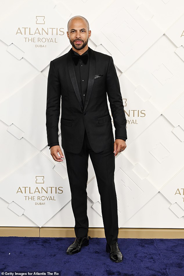 Dapper: Marvin, 37, opted for a classic black blazer and pants which he teamed with a matching shirt