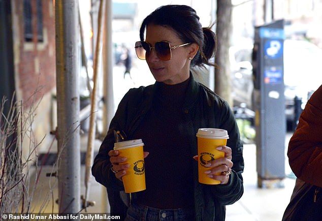 She grabbed two coffees while out with her friend.