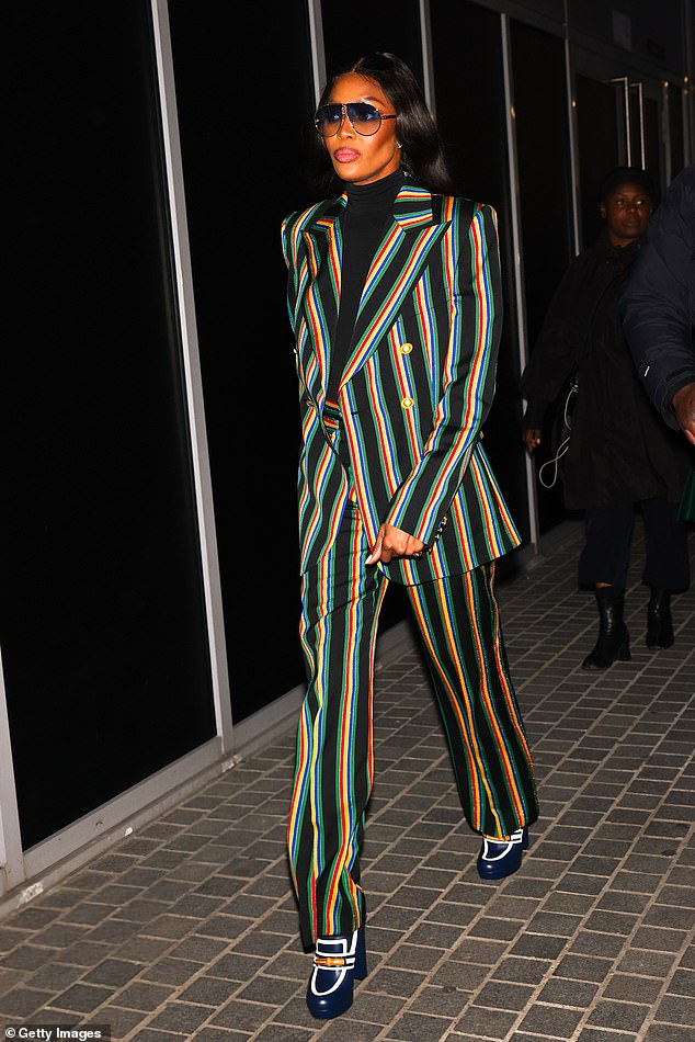 Stepping Out: Posing for some photos before the Casablanca men's show for their Fall-Winter 2023/2024 Menswear show, Naomi stepped out in style in the green, orange and black look.