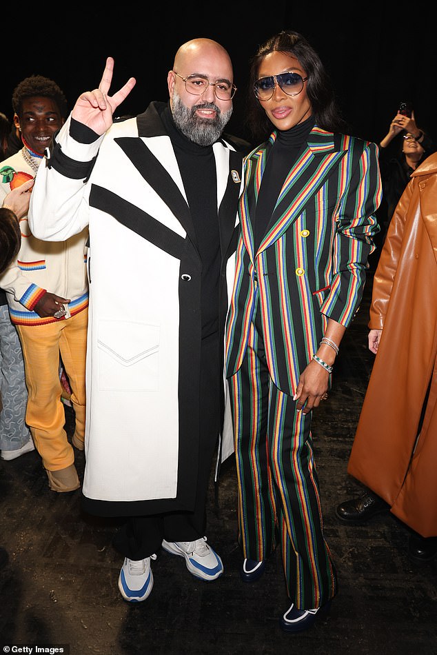 Styling: He greeted Casablanca's creative director, Charaf Tajer, who was wearing an extravagant black and white jacket, teamed with white sneakers.