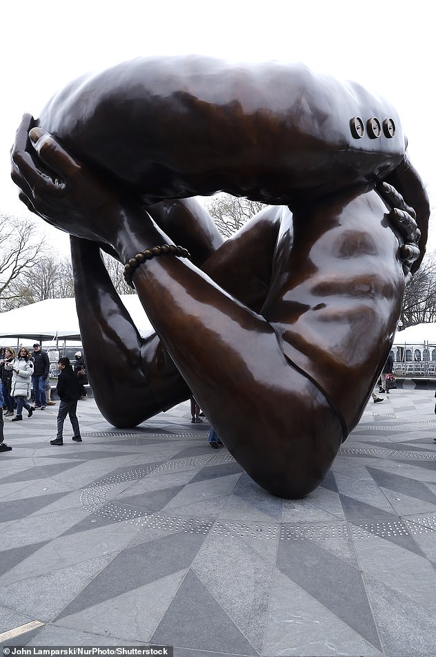 Sightseeing: Before her trip to Harvard, the raven-haired beauty visited the controversial bronze sculpture The Embrace, which is a tribute to Martin Luther King Jr. and his wife Coretta Scott King;  seen on january 15