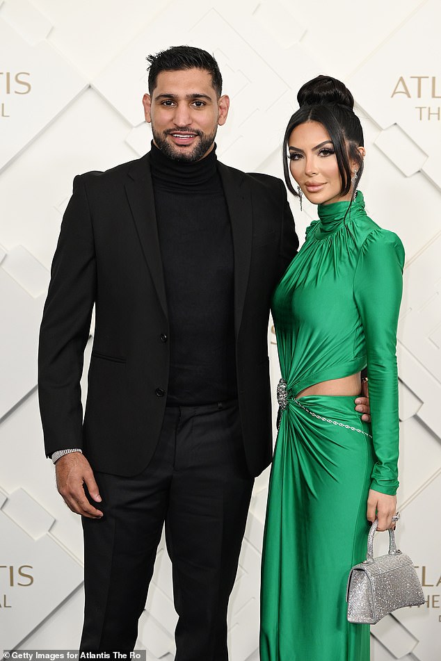 Power Couple: Dressed to impress, the boxer, 36, who married the TV personality, 30, in 2013, donned an all-black outfit while pairing a black turtleneck sweater with a black suit