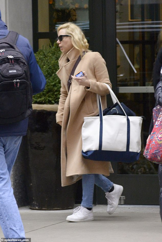 Glam: The 38-year-old Parks and Recreation alumna sported a pair of square-shaped shiny black sunglasses as she stepped out of an SUV