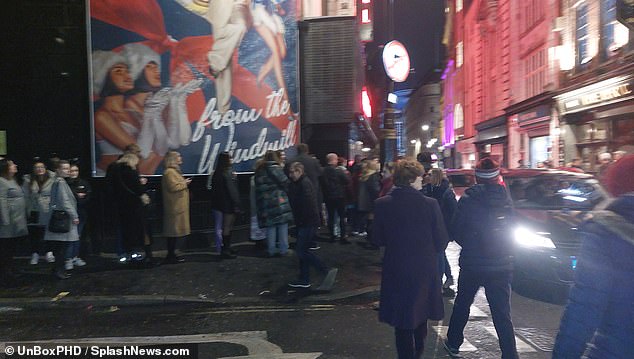 Wait: When it was time for the call, fans were left waiting in Soho as the queue stretched three streets.