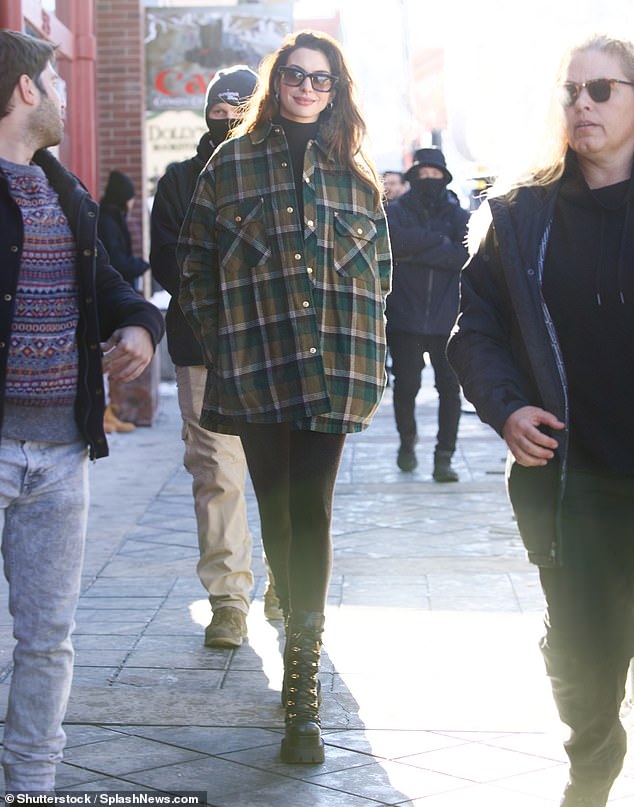 Warm: The Oscar winner held her ground in a pair of lace-up Versace boots  She stayed warm in an oversized plaid jacket in shades of khaki and forest green.