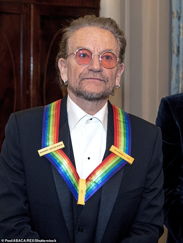 U2 singer Bono, 62, usually has a darker hairstyle