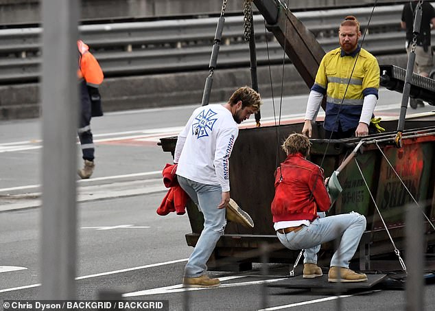 At one point, he appeared to be riding on the edge of a dumpster in scenes that take place on the bridge.