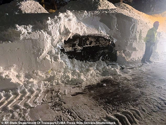 New York State Department of Transportation crews in Western New York are working to uncover and remove abandoned cars and clear ramps on the Kensington Freeway in the city of Buffalo.  In the photo, December 27, 2022