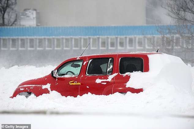 Cars were buried under several feet of snow with people stranded on the roads, unable to get help.