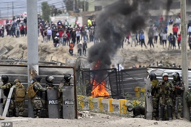 Soldiers clash with anti-government protesters outside the Alfredo Rodríguez Ballón airport in Arequipa, Peru.