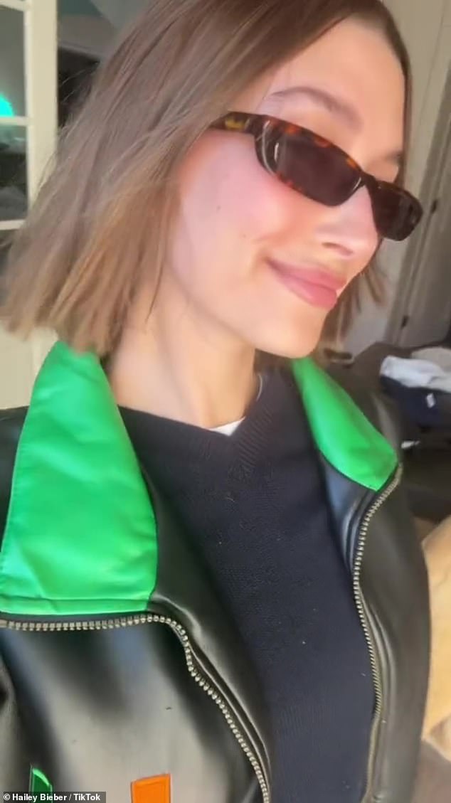 Bieber then flips the video to highlight her blunted bob, along with her stylish sunglasses and University of Miami jacket.