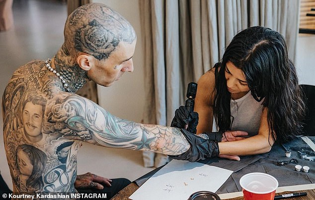 Sealing the deal: As their love story unfolded, Kourtney got a tattoo: 'I love you' on one of her forearms, as seen on her Instagram