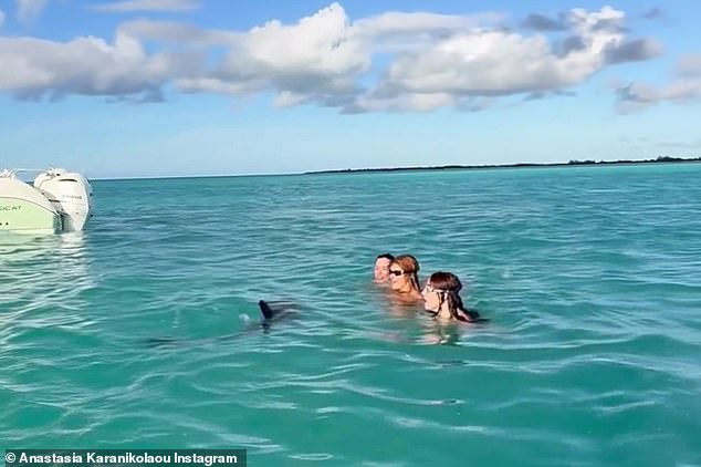 Magical: Karanikolaou posted snippets of his magical experience with the dolphin Jojo.  'Us [heart emoji] swimming with Jojo,