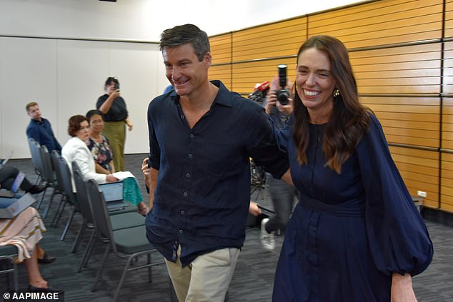 Ms Ardern (pictured right with her partner Clarke Gayford after his resignation speech) endorsed Mr Hipkins as his successor.