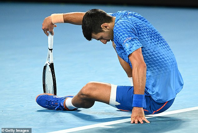 Djokovic falls during the match against Dimitrov, struggling with various ailments in his left leg.