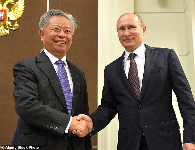 Shake it up: Vladimir Putin welcomes AIIB president Jin Liqun to Russia in 2016