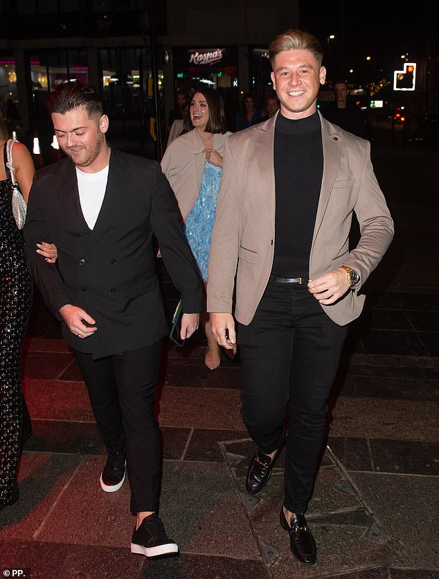 The Boys: Behind them, businessman Bradley Johnson and Reece Donnelly looked dapper as they laughed down the street.