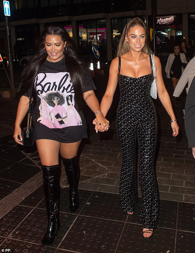 Stylish: Rochelle looked chic when she donned an oversized T-shirt and knee-high black leather boots for a night out