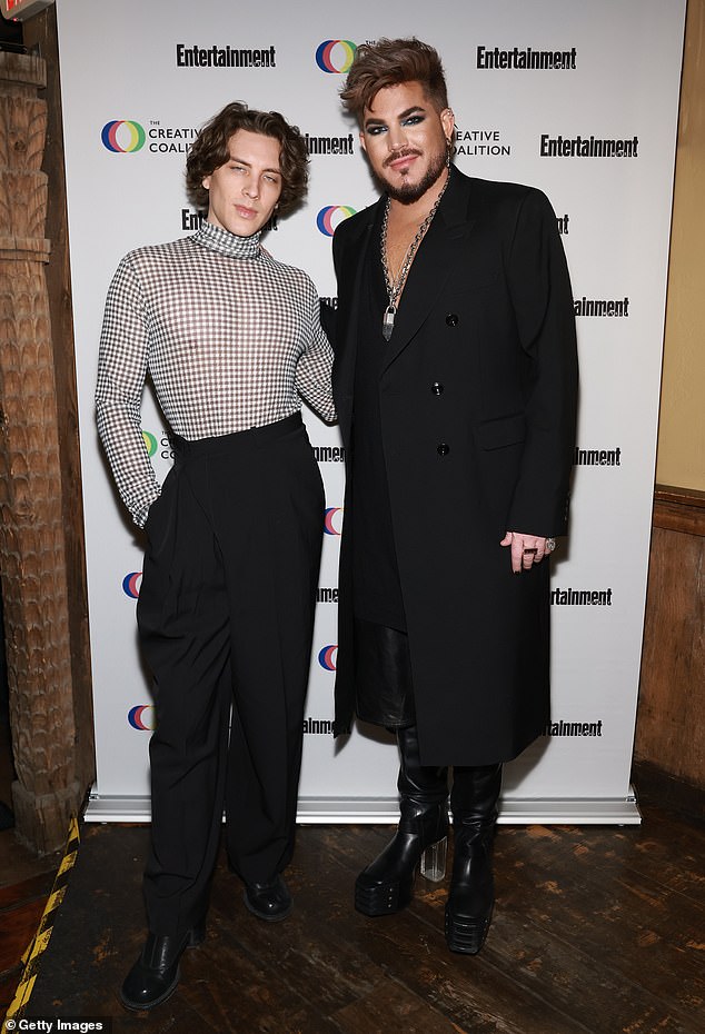 Reunited: Adam was photographed with his fellow co-star, Cody Fern, at the gala  He opted for a sheer patterned shirt that was tucked into a pair of high-waisted black pants.