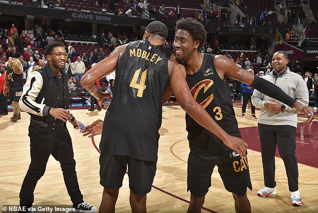 Mobley #4 and Caris LeVert #3 celebrate after the game against the Milwaukee Bucks