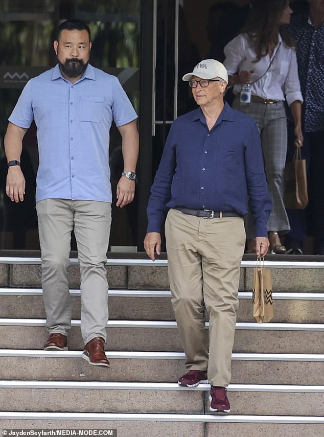 The American tycoon looked suitably relaxed in a long-sleeved blue shirt paired with a pair of tan chinos and a belt.