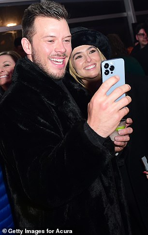 Having fun: The actor also opted for warmth when he joined Zoey on the eventful night