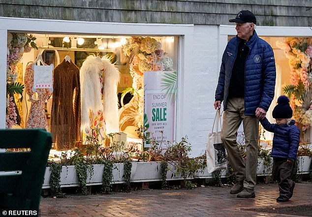 President Biden walks down a Nantucket street on November 26, holding hands with his grandson Beau, 2